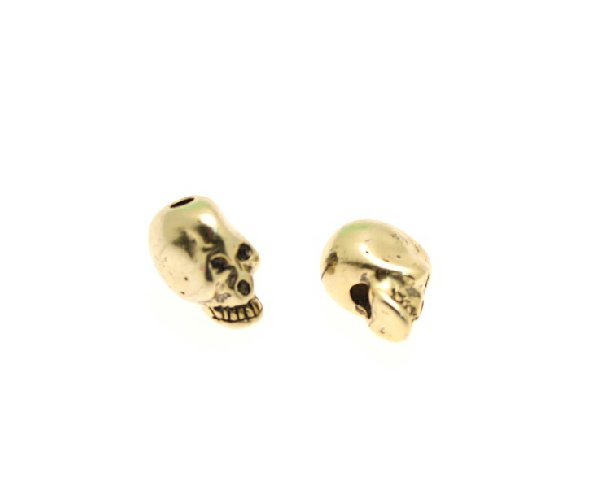 Distanziatore a forma di teschio bombato, foro passante verticale testa-mento, 7x10 mm.
