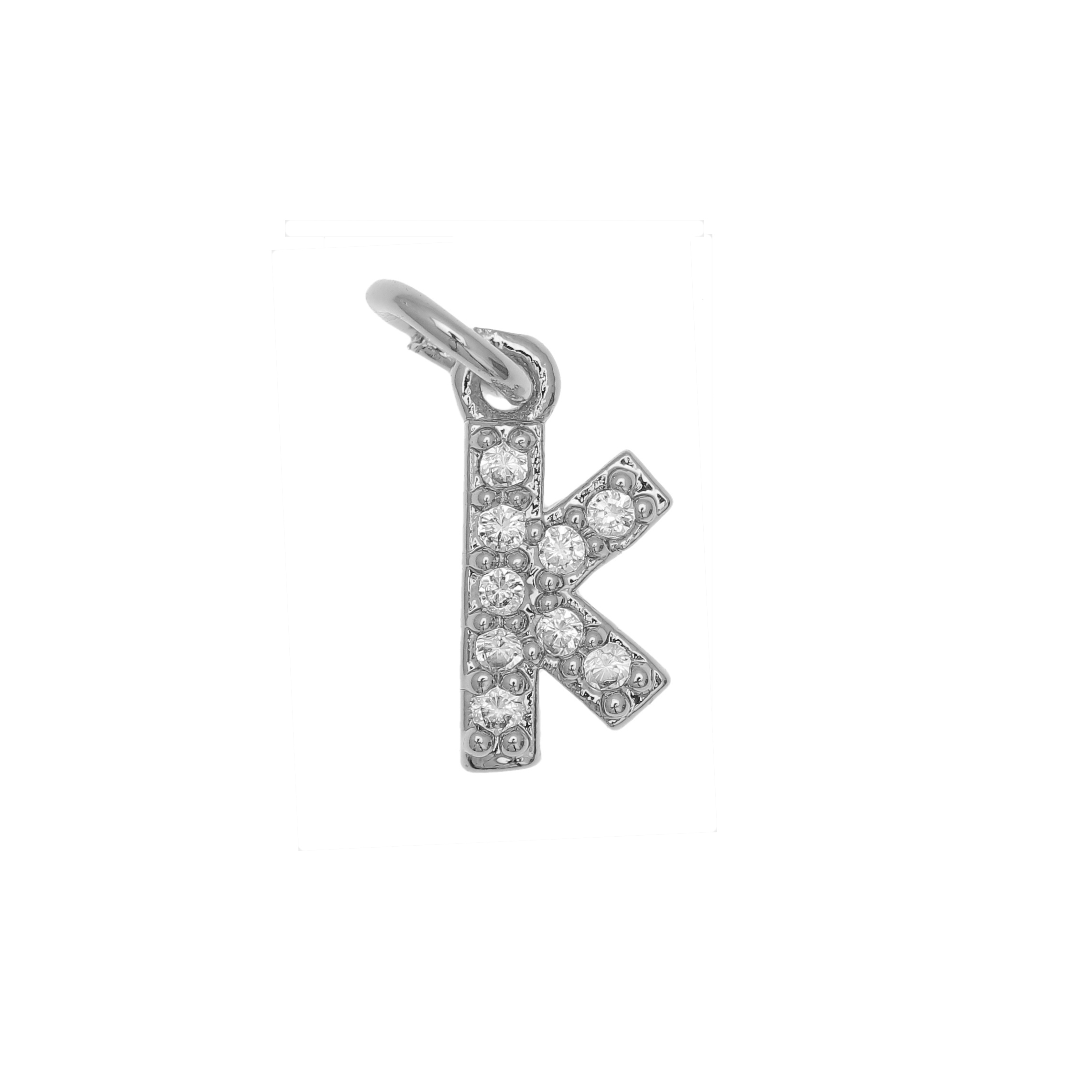 Ciondolo a forma di lettera "K", 9x4 mm., strass colore Crystal, base colore Argento Rodio