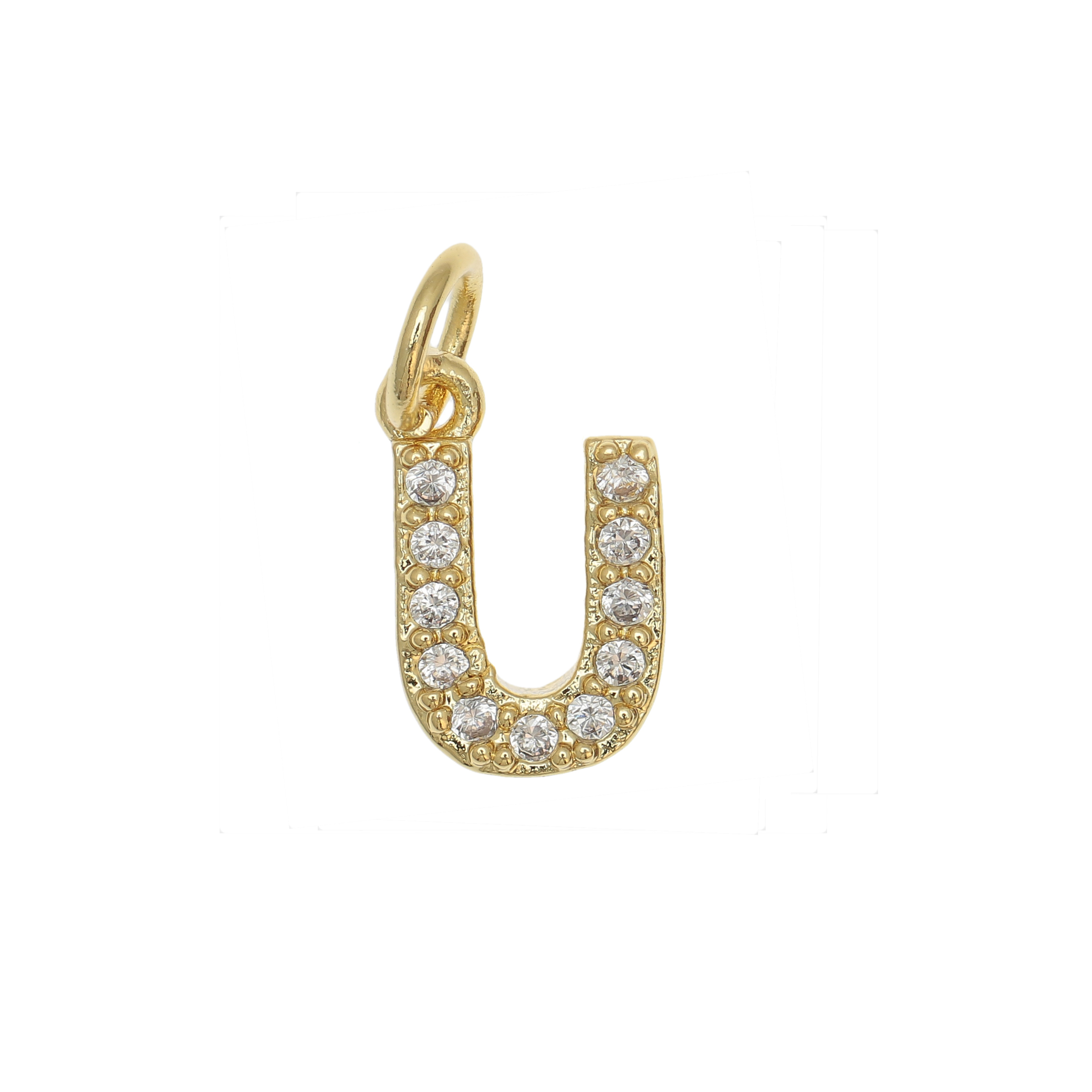Ciondolo a forma di lettera "U", 9x5 mm., strass colore Crsytal, base colore Oro Lucido